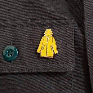 Yellow Raincoat Climate Solidarity pin