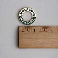 Load image into Gallery viewer, Green New Deal enamel lapel pin and ruler for scale