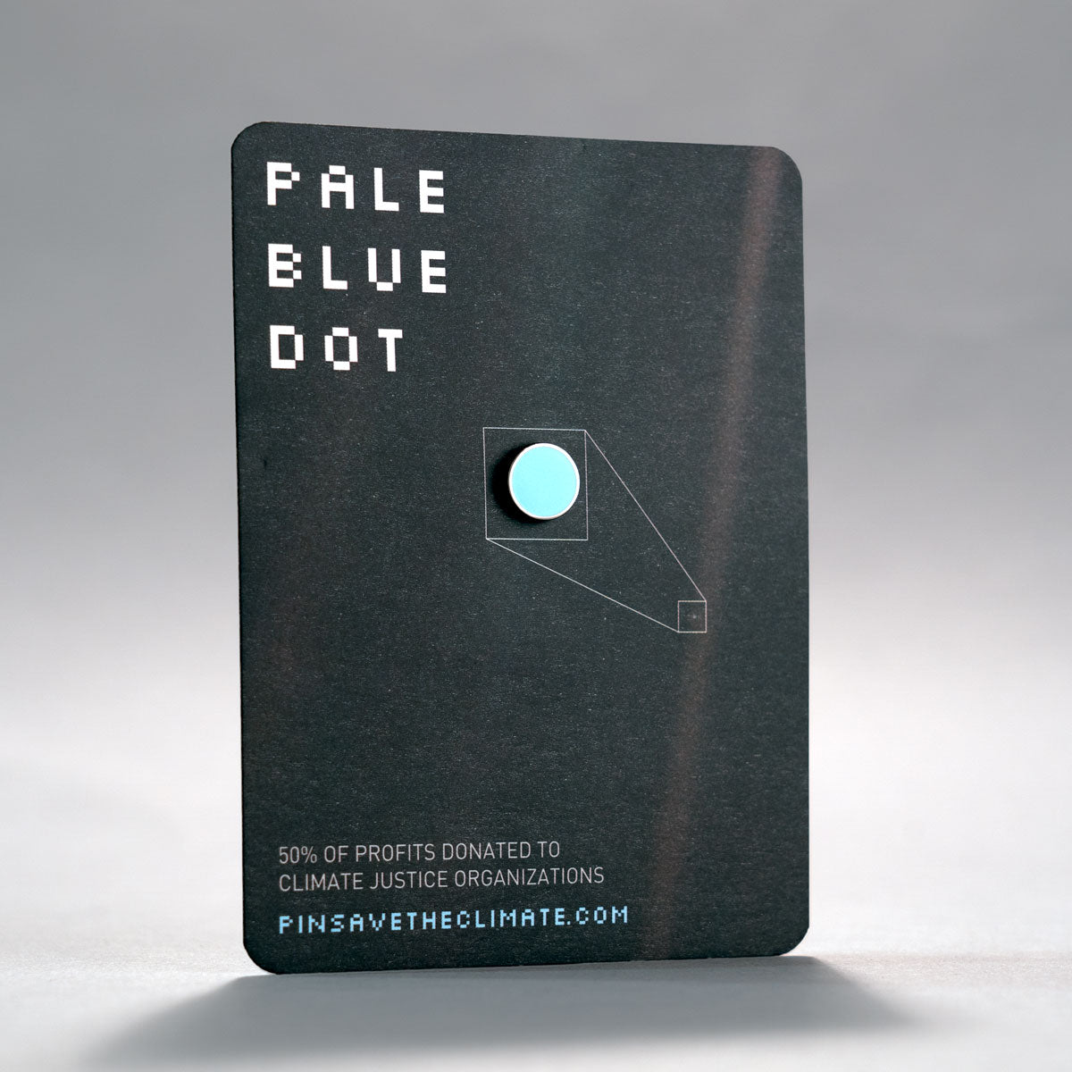 carl sagan inspired pale blue dot enamel lapel pin on backing card