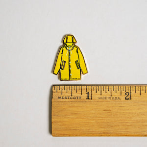 Yellow Raincoat Climate Solidarity pin